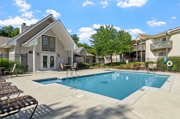 Sparkling outdoor pool with sundeck